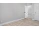 Neutral bedroom with new floors and an open door at 2806 Chaucer Sw Dr, Atlanta, GA 30311