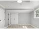 Neutral bedroom with ceiling fan, closet, and a window for lots of natural light at 2806 Chaucer Sw Dr, Atlanta, GA 30311