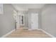 Neutral bedroom with new flooring, closet and view into hallway at 2806 Chaucer Sw Dr, Atlanta, GA 30311