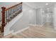This is a shot of the hallway and stairs with hardwood floors and neutral-colored paint at 2806 Chaucer Sw Dr, Atlanta, GA 30311