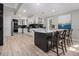 Bright kitchen with an island, granite countertops, a wine rack, and modern appliances at 2806 Chaucer Sw Dr, Atlanta, GA 30311