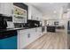 Modern kitchen boasting sleek white cabinets, dark countertops, and stainless steel appliances at 2806 Chaucer Sw Dr, Atlanta, GA 30311