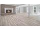 This living room features hardwood floors, neutral paint, a fireplace, and bright natural light at 2806 Chaucer Sw Dr, Atlanta, GA 30311