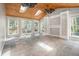 Bright living room featuring skylights, hardwood floors, and built in shelving at 2806 Chaucer Sw Dr, Atlanta, GA 30311