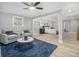 Inviting living room with plush seating, ceiling fan, and access to the main bedroom at 2806 Chaucer Sw Dr, Atlanta, GA 30311