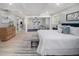 This spacious main bedroom boasts an open concept with modern decor, hardwood flooring, and natural light at 2806 Chaucer Sw Dr, Atlanta, GA 30311