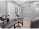 Bright and airy office space with a view of an adjoining room, featuring a desk and storage at 2806 Chaucer Sw Dr, Atlanta, GA 30311