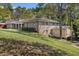 Charming two-story home with a landscaped yard and an attached structure at 2806 Chaucer Sw Dr, Atlanta, GA 30311