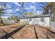 A beautiful backyard with a new wooden deck and light-colored siding at 3460 Fairlane Dr, Atlanta, GA 30331