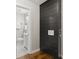Hallway featuring built-in storage, a bathroom with a vanity and commode at 3460 Fairlane Dr, Atlanta, GA 30331