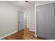 Bedroom with hardwood floors and a closet with gray doors at 3460 Fairlane Dr, Atlanta, GA 30331