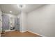 Bedroom with an open door to the attached bathroom, hardwood floors, and neutral paint at 3460 Fairlane Dr, Atlanta, GA 30331