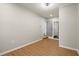 Bedroom with an open door to the attached bathroom, hardwood floors, and neutral paint at 3460 Fairlane Dr, Atlanta, GA 30331