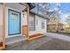 Close up of a newly renovated home featuring a vibrant blue door and freshly painted brick at 3460 Fairlane Dr, Atlanta, GA 30331