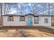 Charming house with attractive shutters and a cheerful blue door at 3460 Fairlane Dr, Atlanta, GA 30331