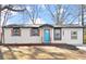 Charming single-story home with a freshly painted exterior and a bright blue front door at 3460 Fairlane Dr, Atlanta, GA 30331