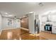 Open-concept living area with hardwood floors seamlessly connecting to a modern, white kitchen at 3460 Fairlane Dr, Atlanta, GA 30331