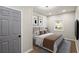 Staged bedroom with hardwood floors, neutral paint, modern decor, and a ceiling fan at 3460 Fairlane Dr, Atlanta, GA 30331