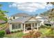 Backyard aerial showcasing manicured lawn and covered patio with stylish outdoor furniture at 4025 Connolly Ct, Roswell, GA 30075