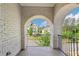 Charming balcony features arched brick entryway with wrought-iron railing and neighborhood views at 4025 Connolly Ct, Roswell, GA 30075
