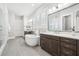 Bright bathroom with soaking tub, dual vanities, walk-in shower, and sleek modern fixtures at 4025 Connolly Ct, Roswell, GA 30075