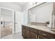 Bathroom with a dark wood vanity with stone countertops at 4025 Connolly Ct, Roswell, GA 30075