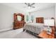 Cozy bedroom featuring matching wooden furniture set and window shutters at 4025 Connolly Ct, Roswell, GA 30075