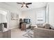 Bright bedroom with a ceiling fan, a comfortable couch, and a work desk set up at 4025 Connolly Ct, Roswell, GA 30075
