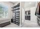 Spacious walk-in closet with custom shelving, carpet, and storage for an organized wardrobe at 4025 Connolly Ct, Roswell, GA 30075