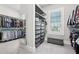 A spacious walk-in closet with ample shelving, hanging space, and natural light at 4025 Connolly Ct, Roswell, GA 30075