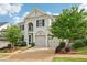 Lovely two-story home with a well-maintained lawn and a two-car garage at 4025 Connolly Ct, Roswell, GA 30075