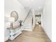 Inviting foyer with hardwood floors, staircase, and modern decor at 4025 Connolly Ct, Roswell, GA 30075