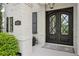 Close-up of the beautiful front entrance with elegant double doors and manicured bushes at 4025 Connolly Ct, Roswell, GA 30075