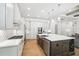 Open concept kitchen with large island, stainless steel appliances, and view to the living room at 4025 Connolly Ct, Roswell, GA 30075