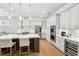 Modern kitchen with stainless steel appliances, white cabinets, and spacious center island at 4025 Connolly Ct, Roswell, GA 30075