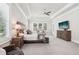 Bright main bedroom with tray ceiling, plantation shutters, and stylish furnishings at 4025 Connolly Ct, Roswell, GA 30075