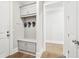 Mudroom features coat hooks, bench, and storage cabinets at 4025 Connolly Ct, Roswell, GA 30075