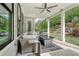 An outdoor patio with comfortable seating, a fireplace, and lush landscaping at 4025 Connolly Ct, Roswell, GA 30075