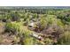 Aerial view of the home and property featuring outbuildings, gardens, and lush landscape, perfect for a rural lifestyle at 700 Stewart Rd, Covington, GA 30016