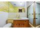 Bathroom featuring a shower with glass door and a vanity with a sink at 700 Stewart Rd, Covington, GA 30016