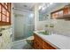 Bathroom features a shower with glass door and a vanity with a sink at 700 Stewart Rd, Covington, GA 30016