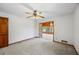 Spacious bedroom featuring a ceiling fan and doorway to a sunroom at 700 Stewart Rd, Covington, GA 30016
