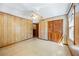 Cozy bedroom with wood paneling and ample closet space at 700 Stewart Rd, Covington, GA 30016