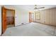 Bedroom with ceiling fan, carpet, and doorways to other rooms at 700 Stewart Rd, Covington, GA 30016