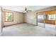 Bedroom featuring a ceiling fan, an exterior window and an interior glass sliding door at 700 Stewart Rd, Covington, GA 30016