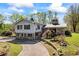 Two-story home with vinyl siding, stone accents, and a well-maintained lawn at 700 Stewart Rd, Covington, GA 30016