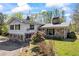 Beautiful two-story home with vinyl siding, stone accents, and lush greenery at 700 Stewart Rd, Covington, GA 30016