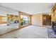 Living room featuring stone fireplace, floor to ceiling mirrors and backyard view at 700 Stewart Rd, Covington, GA 30016