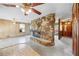 Open concept living room featuring unique stone fireplace at 700 Stewart Rd, Covington, GA 30016