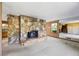 Bright living room with a unique stone fireplace and accent wall at 700 Stewart Rd, Covington, GA 30016
